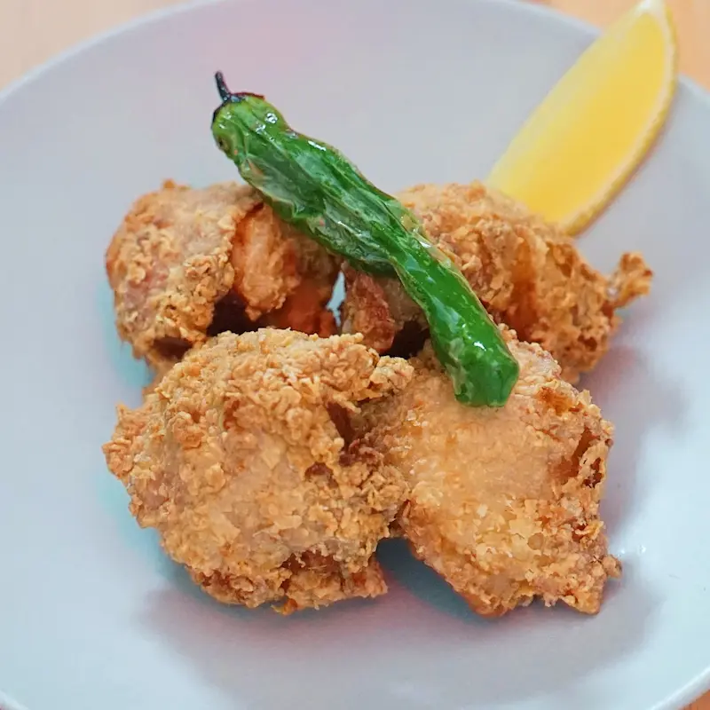 Chicken Kara Age - Crispy boneless Japanese fried chicken, golden-brown exterior with tender and juicy interior, served in 4 pieces